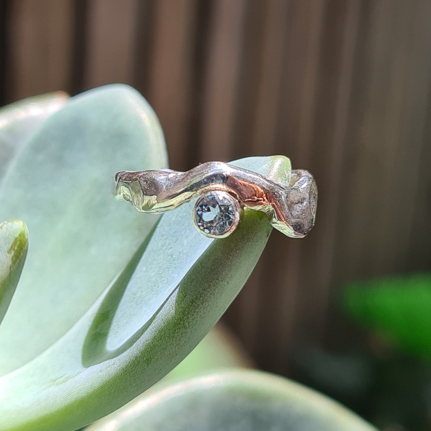 Sterling silver fun molten ring with blue topaz