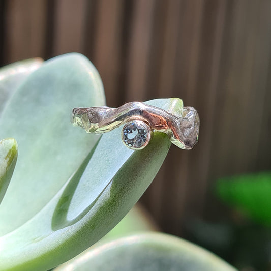 Sterling silver fun molten ring with blue topaz